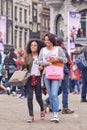 Two exotic girls on Dam Square, Amsterdam, Netherlands