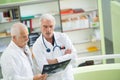 Two experienced doctors looking at two x-ray images Royalty Free Stock Photo