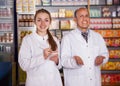 Two experts in drugstore Royalty Free Stock Photo