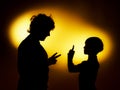 Two expressive boy's silhouettes showing emotions using gesticu Royalty Free Stock Photo