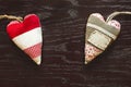 Two fabric hearts on wooden table on Valentine`s day Royalty Free Stock Photo