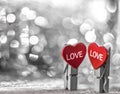 Day of all lovers, valentine `s day, love,Two fallen-in-love cleats with hearts stand next to the background from the side Royalty Free Stock Photo