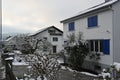 Two family houses and gardens with trees in winter. Royalty Free Stock Photo