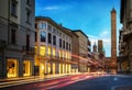 Two famous falling Bologna towers Asinelli and Garisenda. Evening view. Bologna, Emilia-Romagna, Italy. Long exposure, time lapse. Royalty Free Stock Photo