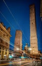 Two famous falling Bologna towers Asinelli and Garisenda. Evening view, long exposure. Bologna, Emilia-Romagna, Italy. Royalty Free Stock Photo