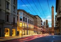 Two famous falling Bologna towers Asinelli and Garisenda. Evening view. Bologna, Emilia-Romagna, Italy. Long exposure, time lapse. Royalty Free Stock Photo