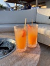 Two fancy drinks at an outdoor bar during the day at a resort Royalty Free Stock Photo