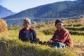 Two farmers , Husband and wife having rest in their rice field , Bhutan
