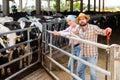 Two farmers posing on dairy farm Royalty Free Stock Photo