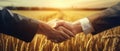 Two Farmers Seal Their Agreement Against A Backdrop Of Wheat