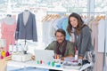 Two fashion designers looking at camera Royalty Free Stock Photo