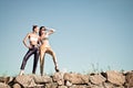 Two fashion girls against blue sky Royalty Free Stock Photo