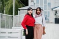 Two fashionable arabian girls friends posed outdoor. Stylish muslim womans