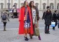 MILAN - FEBRUARY 25, 2018:Two fashionable women posing for photograpers in Duomo square after STELLA JEAN fashion show, during Mil