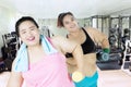 Two fat women with dumbbells in the gym Royalty Free Stock Photo