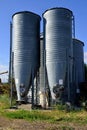 Two feed silos on a small ranch. Royalty Free Stock Photo