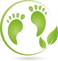 Two feet and leaves, foot care and massage logo Royalty Free Stock Photo