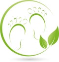 Two feet and leaves, foot care and massage logo Royalty Free Stock Photo