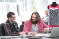 Two fellow designers sitting at a Desk in the Studio Royalty Free Stock Photo