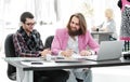 Two fellow designers sitting at a Desk in the Studio Royalty Free Stock Photo