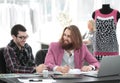 Two fellow designers sitting at a Desk in the Studio Royalty Free Stock Photo