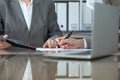 Two female accountants checking financial statement or counting by calculator income for tax form, hands close-up Royalty Free Stock Photo