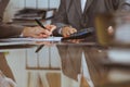 Two female accountants checking financial statement or counting by calculator income for tax form, hands close-up Royalty Free Stock Photo