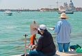 Two female artists painting in Venice.