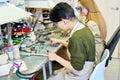 Two Female Artists Working in Glassworking Studio