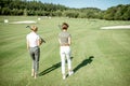 Female friends on a golf course Royalty Free Stock Photo