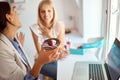 Two female business colleagues in a pastry shop are emotionally reacting to a delicious donut. Pastry shop, dessert, sweet