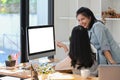 Two female business colleagues working together at modern office. Royalty Free Stock Photo