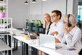 Two female colleages have some flirt with male colleague