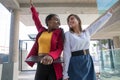 Two female colleagues celebrate the achievement of a goal at work, success and happiness at work Royalty Free Stock Photo