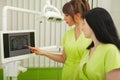 Two female dentist in dental office examining patient teeth Royalty Free Stock Photo