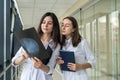 Two female doctors discusses the results of X-ray scan Royalty Free Stock Photo