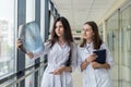 Two female doctors discusses the results of X-ray scan Royalty Free Stock Photo