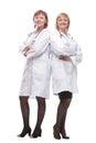 two female doctors with stethoscopes standing together.