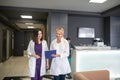 Two female doctors talking in the clinic corridor Royalty Free Stock Photo