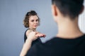 Two female fighter of martial arts practice in gym. Taekwondo coach and student in personal training. Self-defense class for women Royalty Free Stock Photo