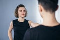 Two female fighter of martial arts practice in gym. Taekwondo coach and student in personal training. Self-defense class for women Royalty Free Stock Photo