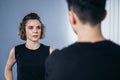 Two female fighter of martial arts practice in gym. Taekwondo coach and student in personal training. Self-defense class for women Royalty Free Stock Photo