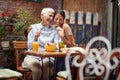 Two female friends of different generations are full of emotions while spending a wonderful time in the bar together. Leisure, bar