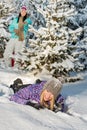 Two female friends enjoy snow winter countryside