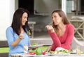 Two female friends enjoying lunch together Royalty Free Stock Photo