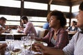 Two female friends at a girlsÃ¯Â¿Â½ lunch in a busy restaurant Royalty Free Stock Photo