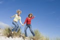 Two female friends having fun on beach Royalty Free Stock Photo