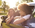 Two Female Friends Or Same Sex Couple In Car On Road Trip Vacation Together Looking Out Of Window Royalty Free Stock Photo