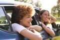 Two Female Friends Or Same Sex Couple In Car On Road Trip Vacation Together Looking Out Of Window Royalty Free Stock Photo