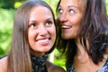 Two female friends are sharing secrets Royalty Free Stock Photo